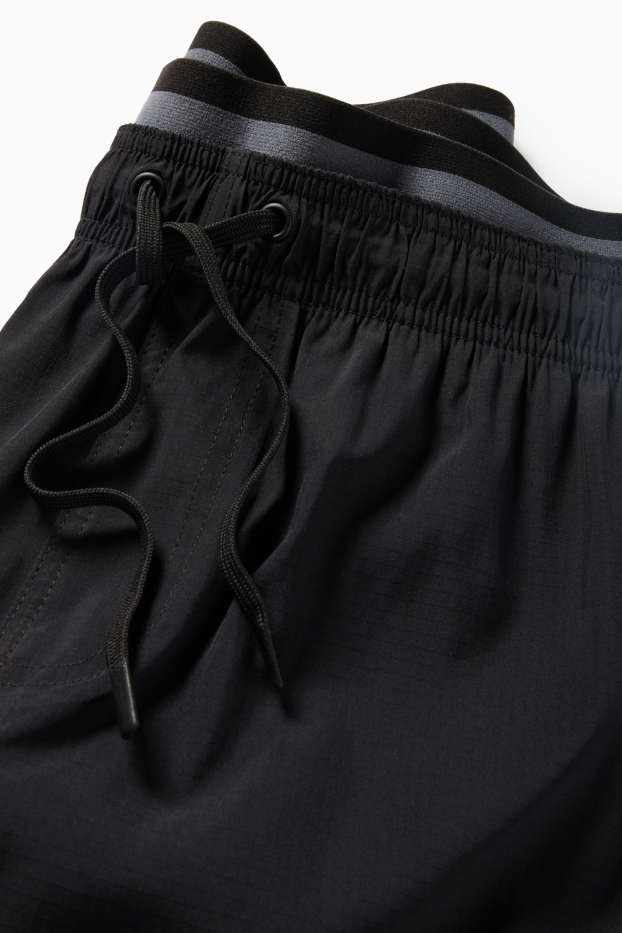 Hommes - Short de bain - look 2-en-1 - noir