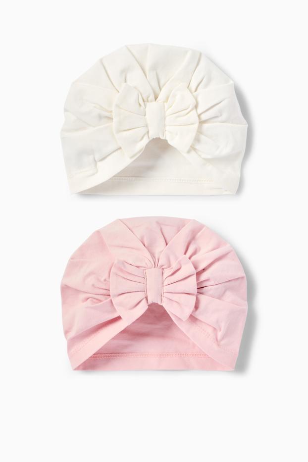 Bebeluși - fete - Multipack 2 buc. - căciulă tip turban - alb / roz