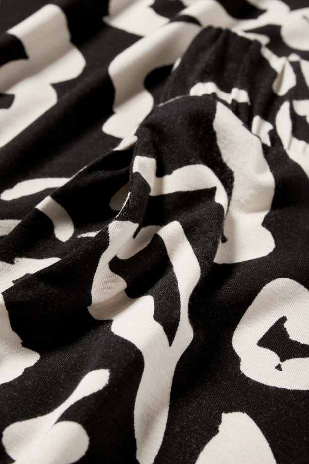 Femmes - Pantalon de jogging - à fleurs - noir / beige