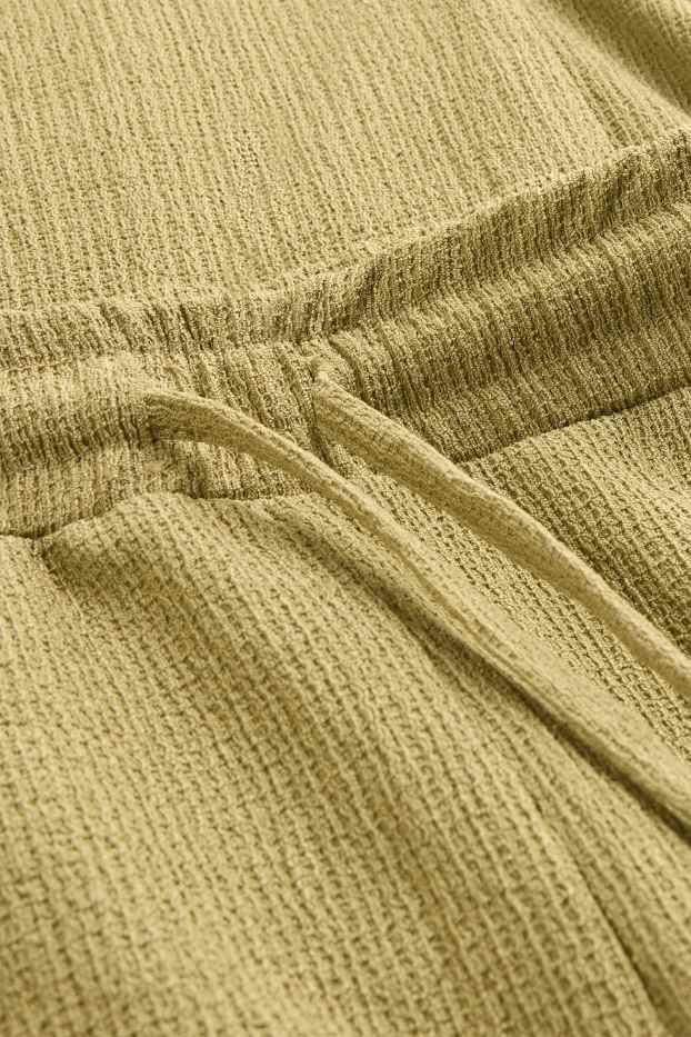 Femei - Pantaloni din jerseu - talie medie - wide leg - structurați - galben