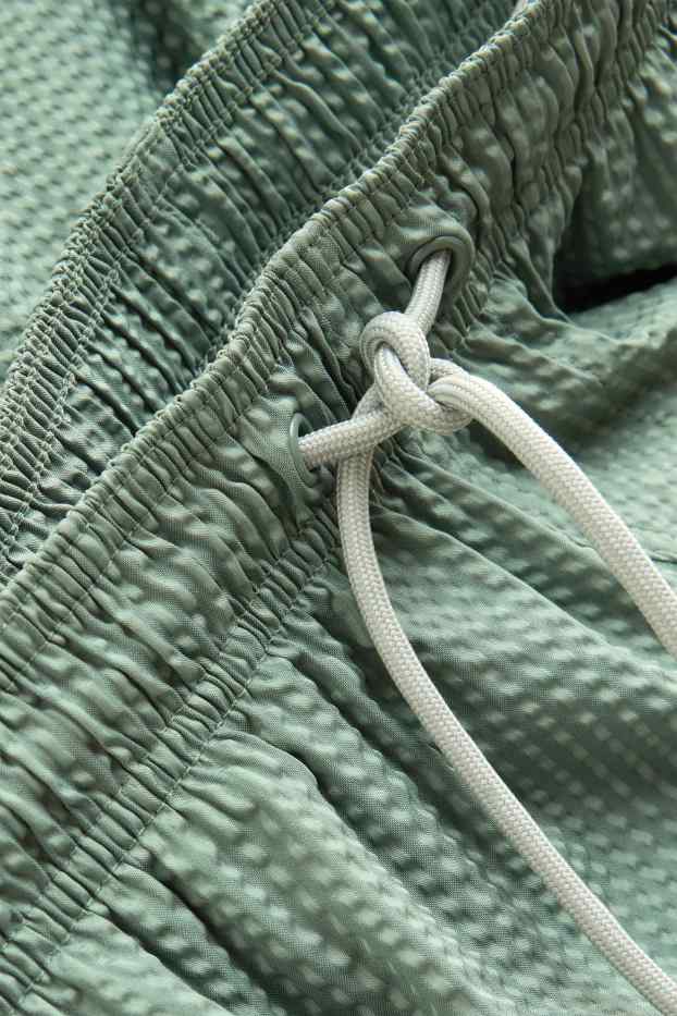 Men - Swim shorts - textured - light green