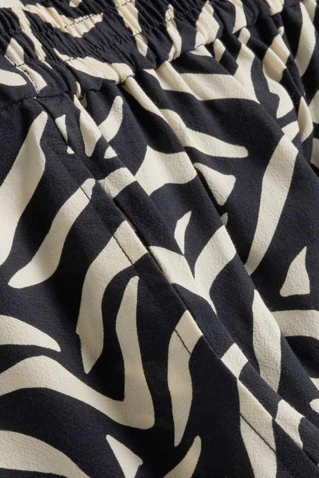 Dona - Pantalons de tela - mid waist - straight fit - estampats - blanc/negre