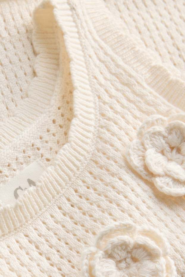 Baby: meisjes - Bloem - gehaakte babytop - crèmekleurig