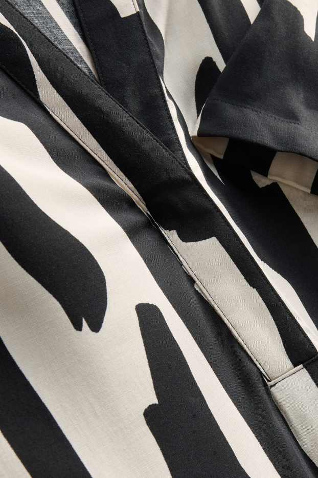 Dames - Viscose jurk met V-hals - met patroon - zwart / wit