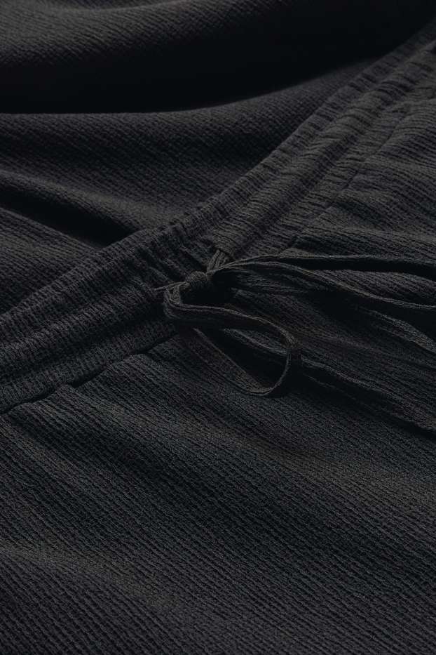 Dames - Jersey broek - mid waist - wide leg - met structuur - zwart