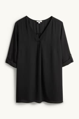 Brusa amb el coll en punta