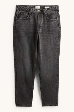Relaxed tapered jeans, deels met linnen.