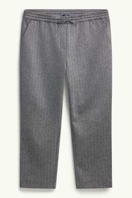 Žerzejové kalhoty - mid waist - tapered fit - se vzorem