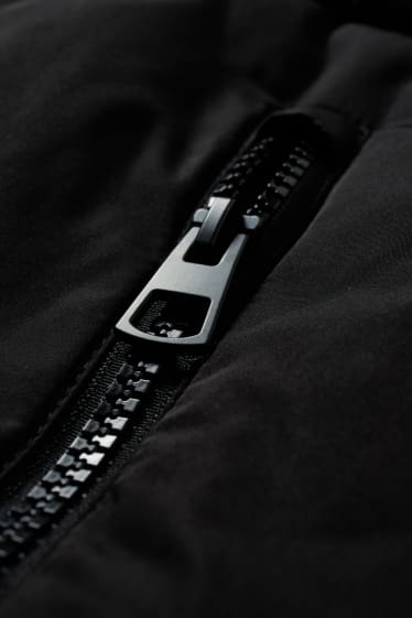 Donna - Gilet trapuntato con cappuccio - nero