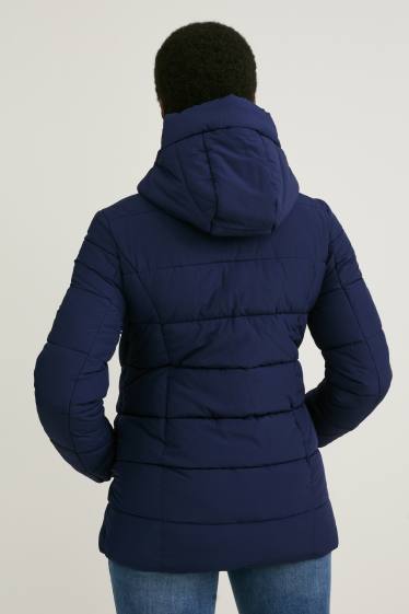 Dámské - Těhotenská prošívaná bunda s kapucí - nosící - tmavomodrá