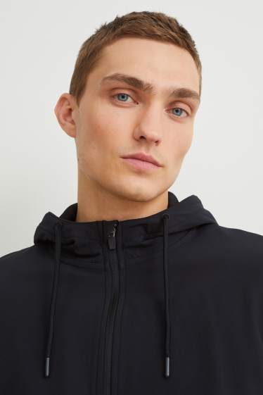 Hommes - Veste en molleton dotée d’une capuche - noir / beige