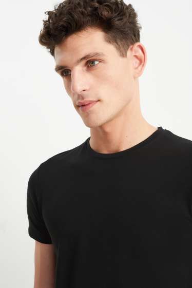 Uomo - T-shirt - Flex - nero