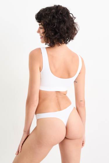 Dámské - Sportovní podprsenka - s vycpávkami - bezešvá - bílá