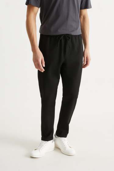 Bărbați - Pantaloni de trening - negru