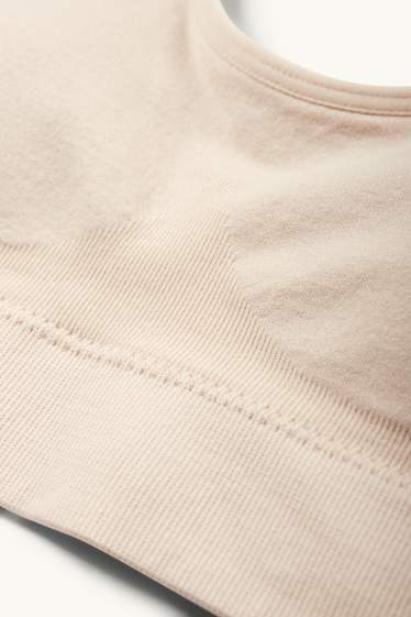 Dámské - Sportovní podprsenka - s vycpávkami - bezešvá - světle béžová