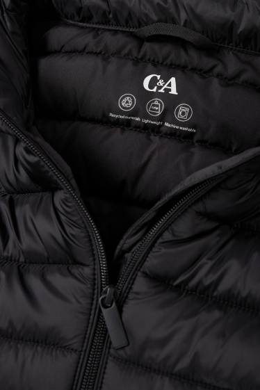 Dames - Lange bodywarmer met capuchon - zwart