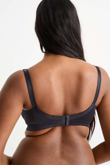 Dona - Sostenidors reductors sense cèrcols - brillants - negre