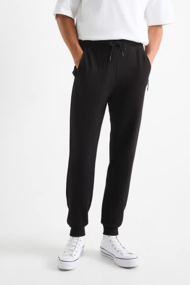 Bărbați - Pantaloni de trening - negru