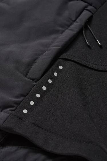 Femmes - Veste chaude de sport à capuche - noir