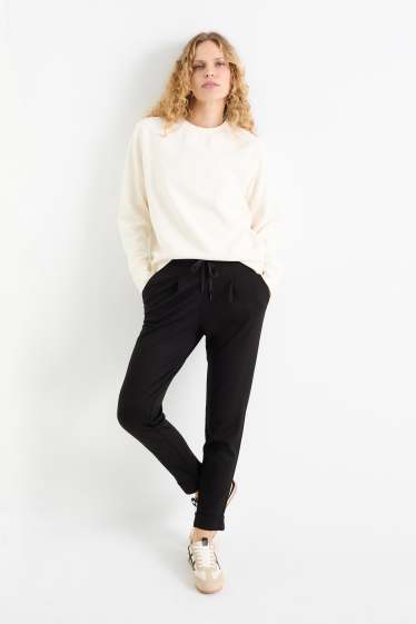 Donna - Pantaloni di jersey - vita media - tapered fit - nero