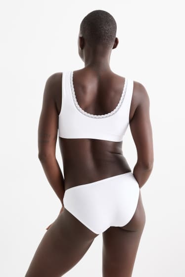 Dámské - Sportovní podprsenka - bezešvá - bílá