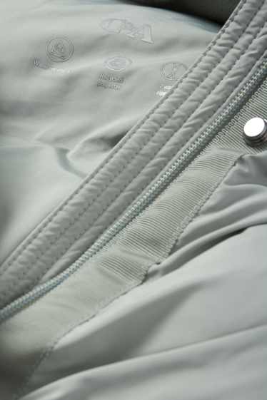 Women - Quilted coat with hood - light green