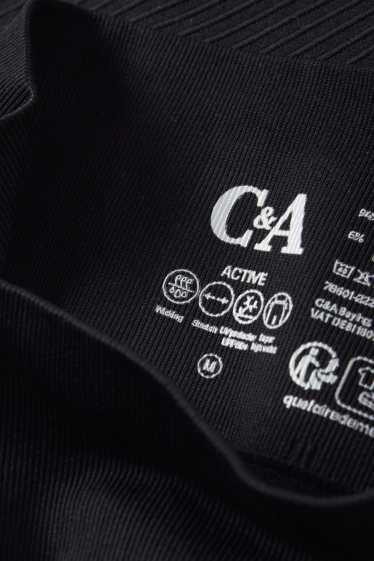 Donna - Leggings tecnici - senza cuciture - tramati - protezione UV - nero