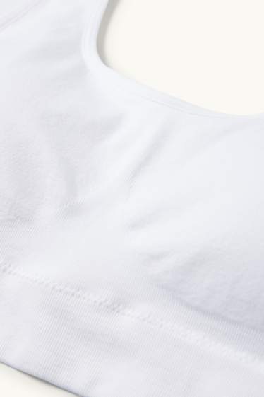 Dámské - Sportovní podprsenka - s vycpávkami - bezešvá - bílá