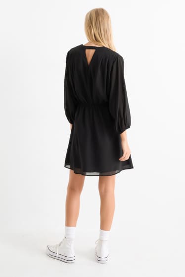 Women - V-neck chiffon dress - textured - black