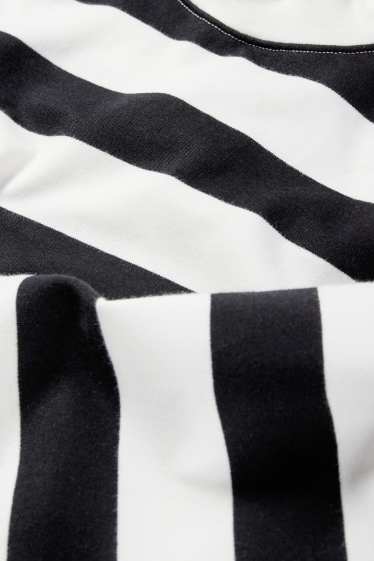 Dona - Dessuadora - de ratlles - negre/blanc