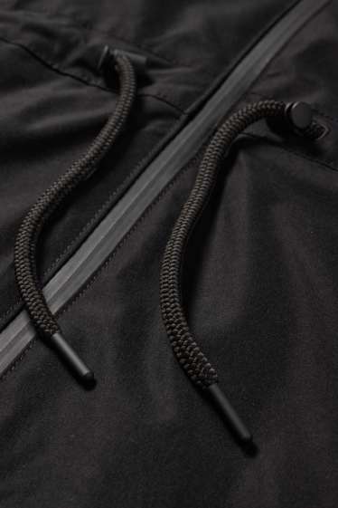 Femmes - Veste de pluie à capuche - imperméable - noir
