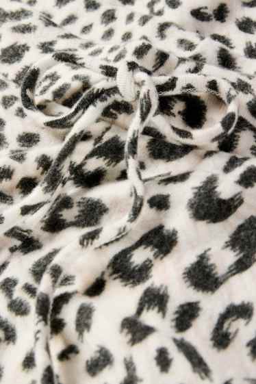 Damen - Flared Leggings - Leo-Print - schwarz / beige