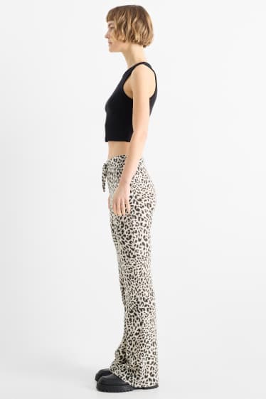 Damen - Flared Leggings - Leo-Print - schwarz / beige