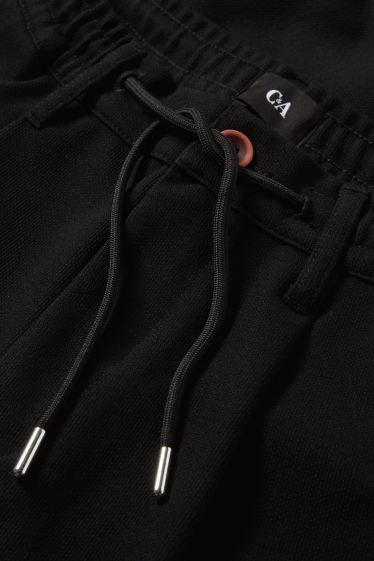 Bărbați - Chino - tapered fit - negru