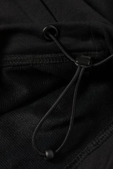 Heren - Oversized sporthoodie - zwart