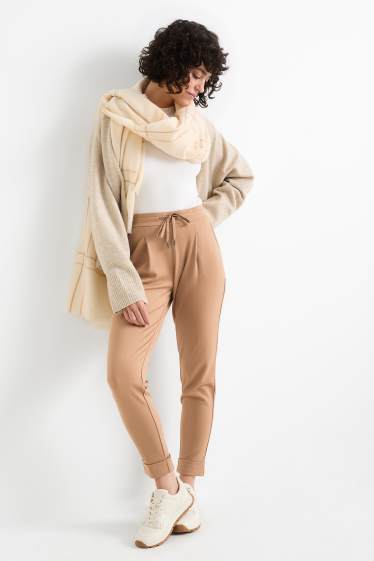 Dona - Pantalons de punt - mid waist - tapered fit - beix