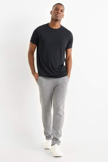 Uomo - Pantaloni sportivi tecnici - grigio chiaro