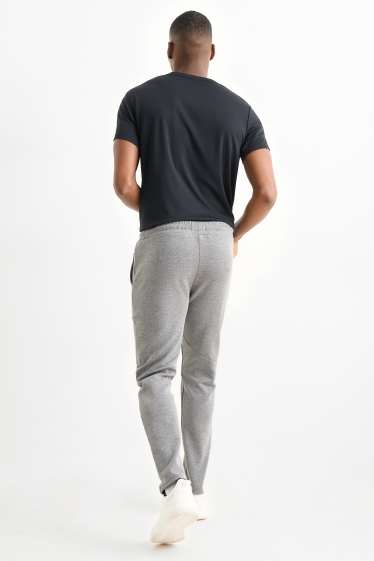 Uomo - Pantaloni sportivi tecnici - grigio chiaro