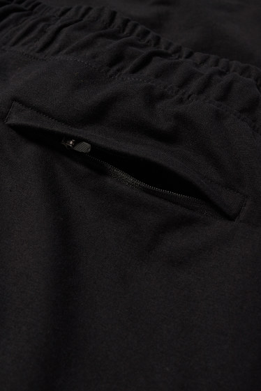 Uomo - Pantaloni sportivi tecnici - nero
