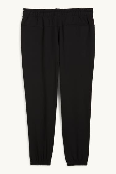 Uomo - Pantaloni sportivi tecnici - nero