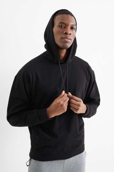 Heren - Oversized sporthoodie - zwart