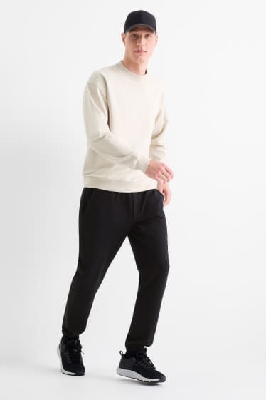 Uomo - Pantaloni sportivi tecnici - nero