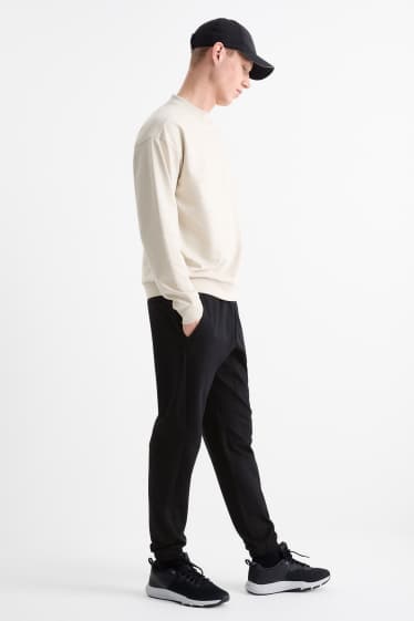 Uomo - Pantaloni sportivi tecnici - nero