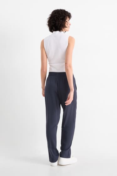 Dona - Pantalons de tela - high waist - tapered fit - blau fosc