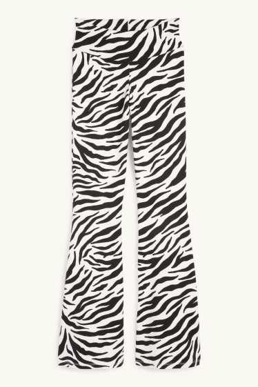 Women - Flared leggings - patterned - black / white