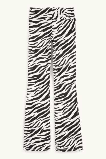 Women - Flared leggings - patterned - black / white