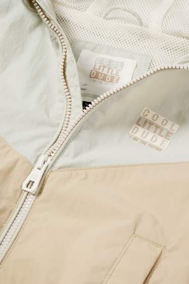 Baby: jongens - Babyjas met capuchon - waterafstotend - beige