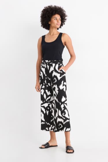 Women - Jersey trousers - high waist - wide leg - patterned - black / white