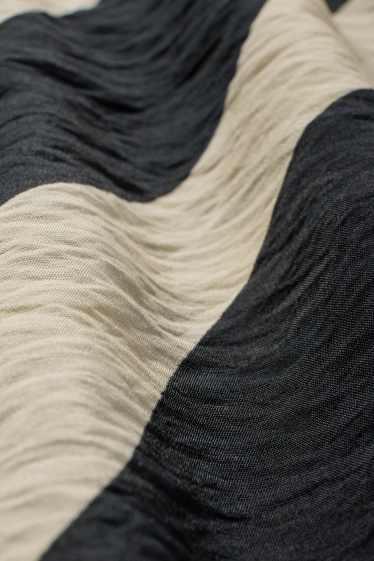Dona - Faldilla - estampada - negre/beix