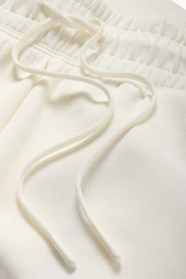 Dona - Pantalons curts tècnics - beix clar